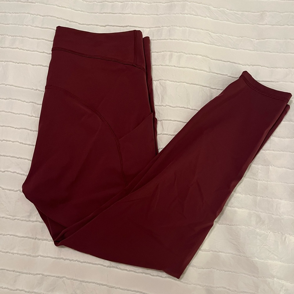 Lululemon Burgundy Leggings with stash pockets. Size 12